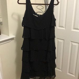 Black sleeveless dress with ruffled beaded tiers